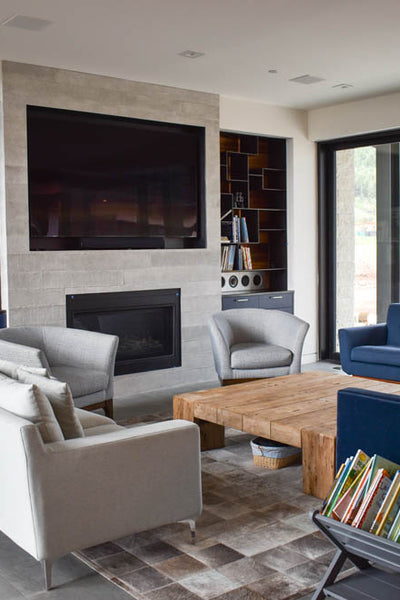 Interior design of living area with custom fireplace and built in tv. Designed by interior designer Erica LeMaster Sargent. 