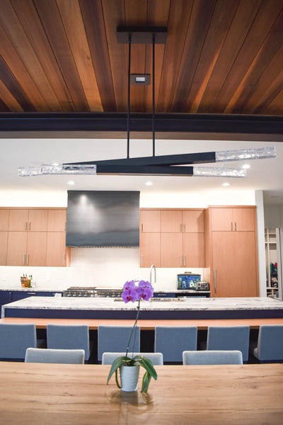 Interior design of kitchen with wood ceiling and blue cabinets. Designed by interior designer Erica LeMaster Sargent. 