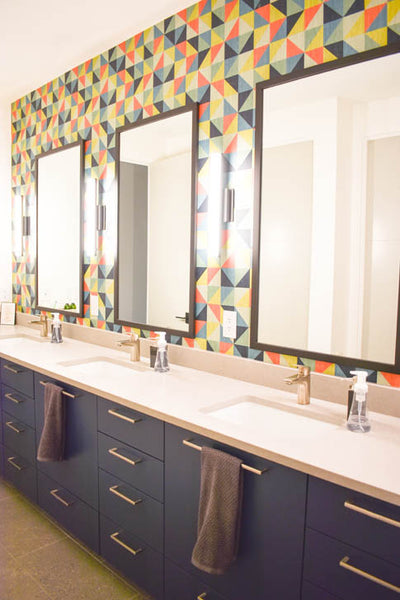 Interior design of triple vanity bathroom with colorful geometric wallpaper. Designed by interior designer Erica LeMaster Sargent. 