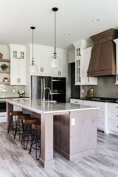 Interior design of kitchen with large island for home in Utah’s 2020 Parade of Homes. Designed by interior designer Erica LeMaster Sargent. 