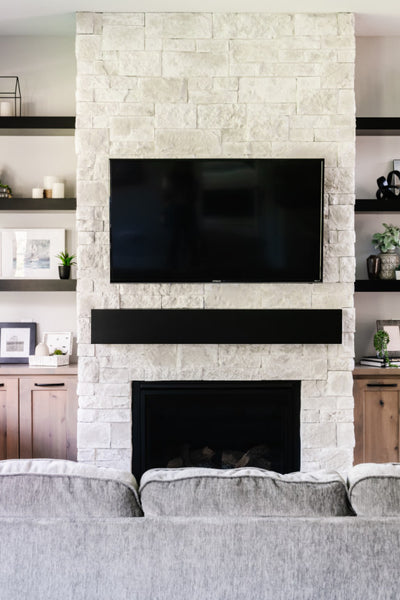 Interior design of living room with television for home in Utah’s 2020 Parade of Homes. Designed by interior designer Erica LeMaster Sargent. 