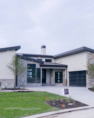 Exterior design of modern styled lake house. Designed by interior designer Erica LeMaster Sargent. 