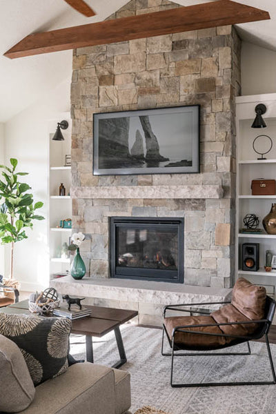 Interior design of transitional ranch styled living room area with custom fireplace and television. Designed by interior designer Erica LeMaster Sargent. 