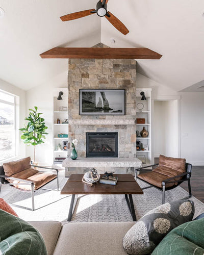 Interior design of transitional ranch styled living area with beautiful leather accent chairs. Designed by interior designer Erica LeMaster Sargent. 