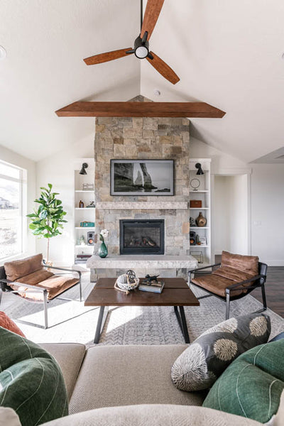 Interior design of transitional ranch styled living area with beautiful leather accent chairs. Designed by interior designer Erica LeMaster Sargent. 