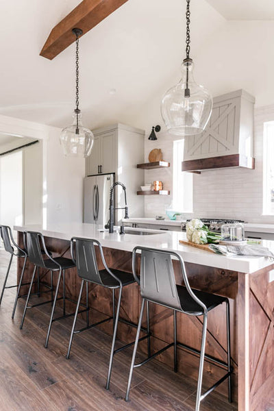 Interior design kitchen with farmhouse style wood island and quartz counter tops. Designed by interior designer Erica LeMaster Sargent. 