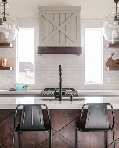 Interior design of kitchen island with metal barstools. Designed by interior designer Erica LeMaster Sargent. 
