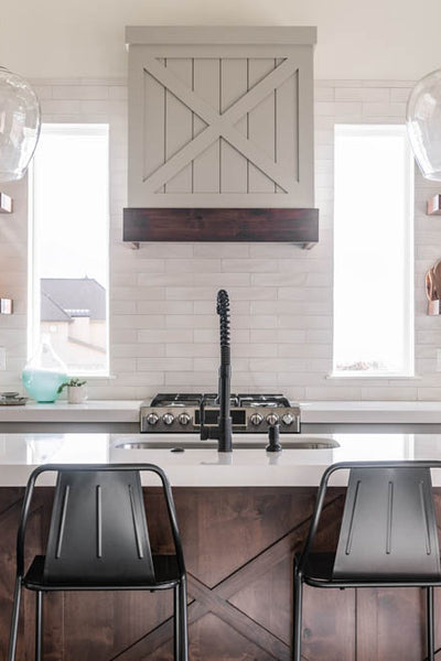 Interior design of kitchen island with metal barstools. Designed by interior designer Erica LeMaster Sargent. 