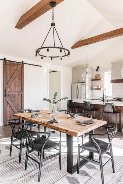 Interior design of kitchen dining area with natural wood table in transitional farmhouse. Designed by interior designer Erica LeMaster Sargent. 