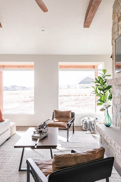 Interior design of living room area with large windows on ranch. Designed by interior designer Erica LeMaster Sargent. 