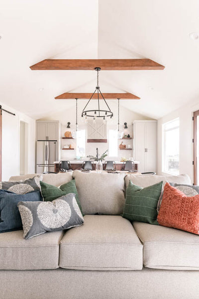 Interior design of vaulted ceilings with natural wood beams. Designed by interior designer Erica LeMaster Sargent. 