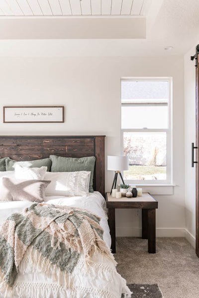 Interior design of guest bedroom with natural wood headboard on bed. Designed by interior designer Erica LeMaster Sargent. 