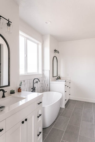 Interior design of master bath with large free standing bathtub. Designed by interior designer Erica LeMaster Sargent. 