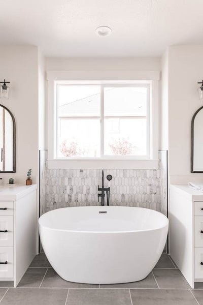 Interior design of master bathroom free standing tub and double vanity. Designed by interior designer Erica LeMaster Sargent. 