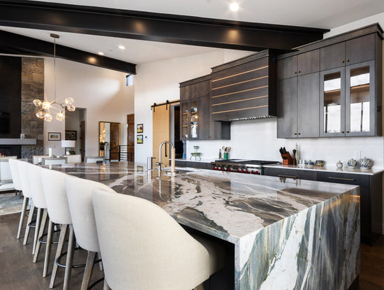 Interior design of kitchen with dark cabinets and unique granite countertops from our Mountain Eclectic Home project. Designed by interior designer Erica LeMaster Sargent. 